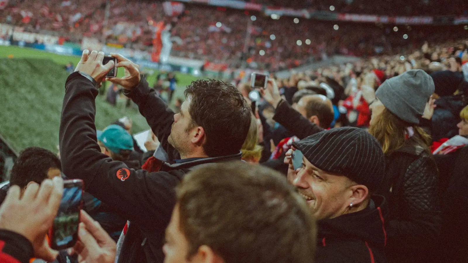 Football fans celebrating in the stands