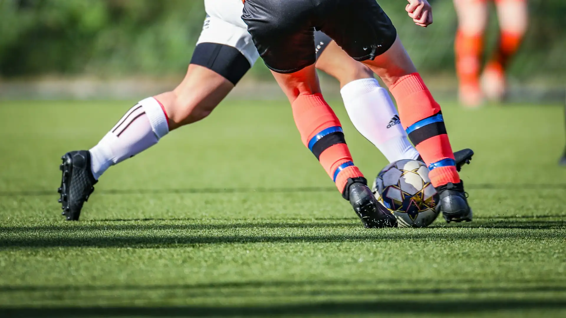 Close-up football match action streamed in 4K